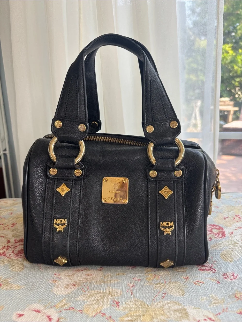 MCM Black Leather Satchel with Gold Hardware Accents